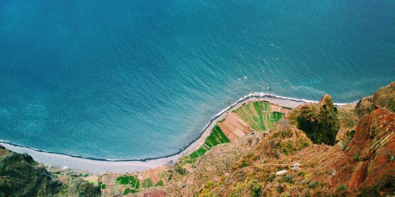 A contemporary dining room featuring a stylish dining table, elegant pendant lighting, and a well-placed area rug.